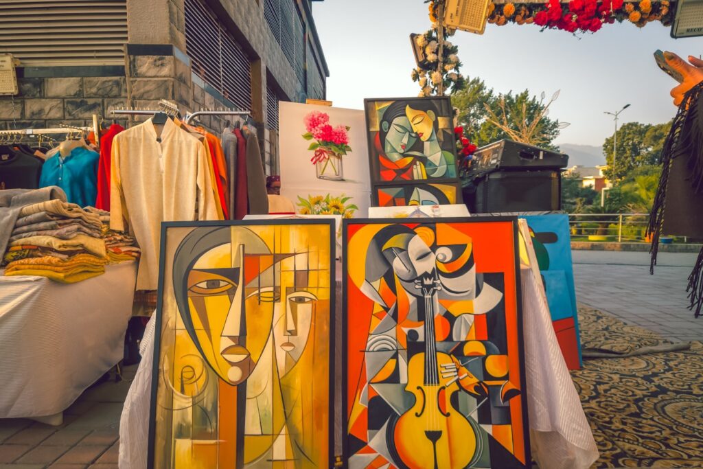A surreal, abstract artwork capturing the essence of a face through fragmented, cubist-style shapes reminiscent of Picasso's influence. The use of bold, layered textures and geometric color blocks creates a striking visual that feels both artistic and emotional, evoking depth and curiosity.