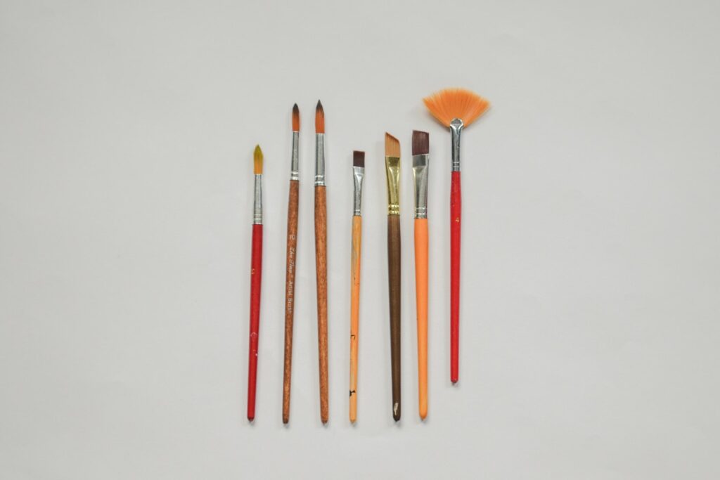a group of paint brushes sitting next to each other