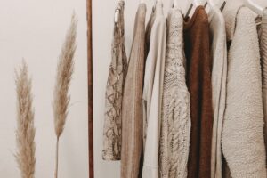 hanged top on brown and white clothes horse