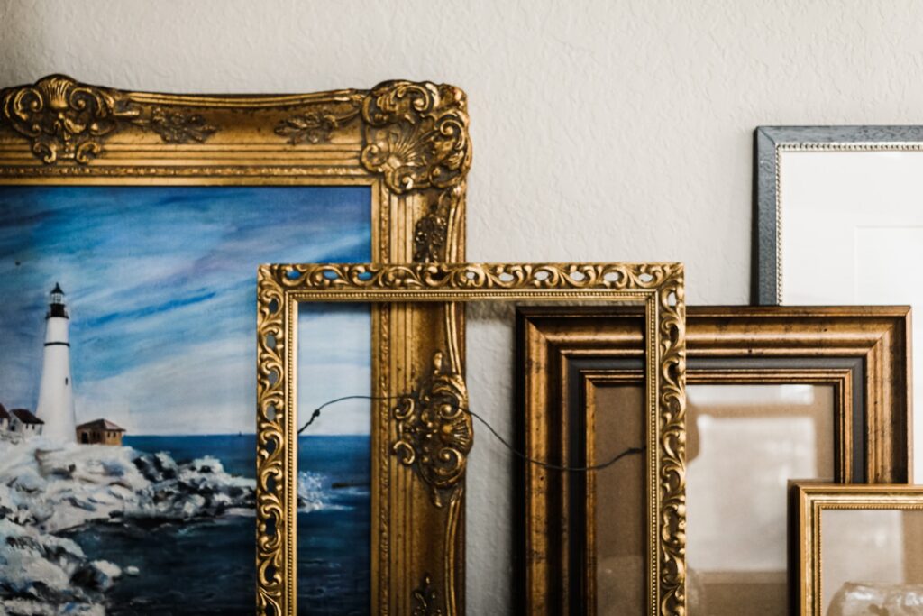 gold framed mirror on white wall