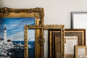gold framed mirror on white wall