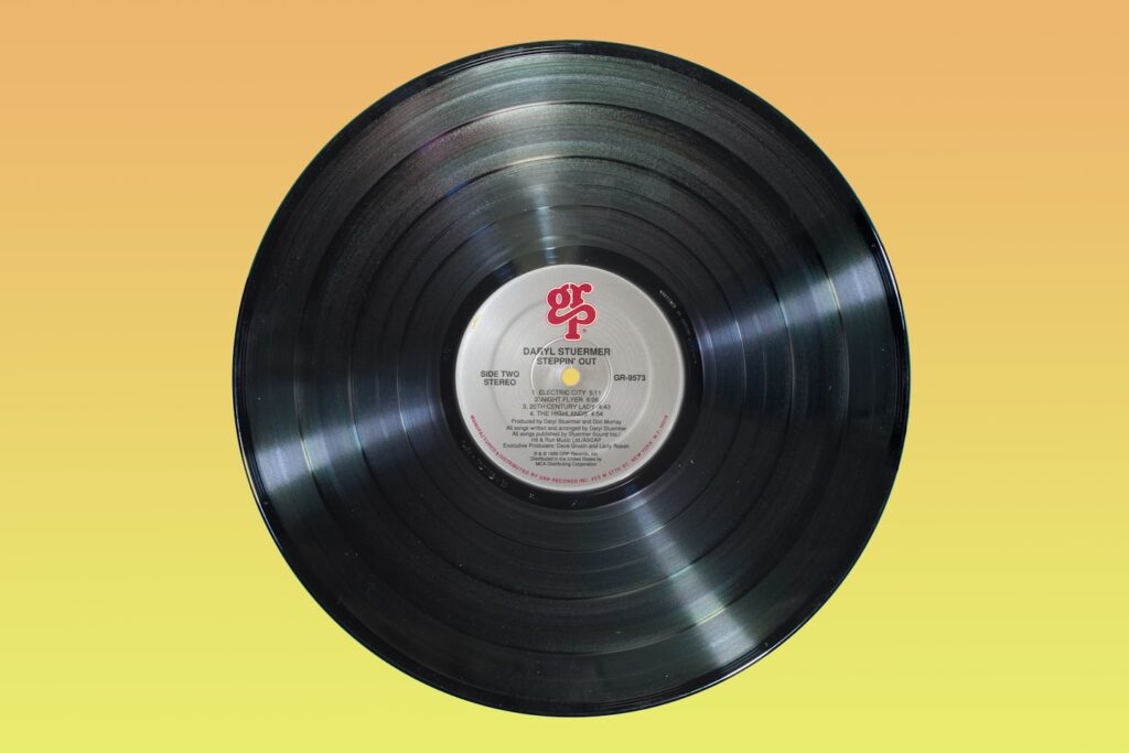 Long play record on yellow background