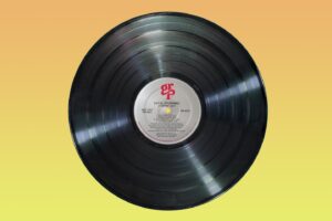 Long play record on yellow background
